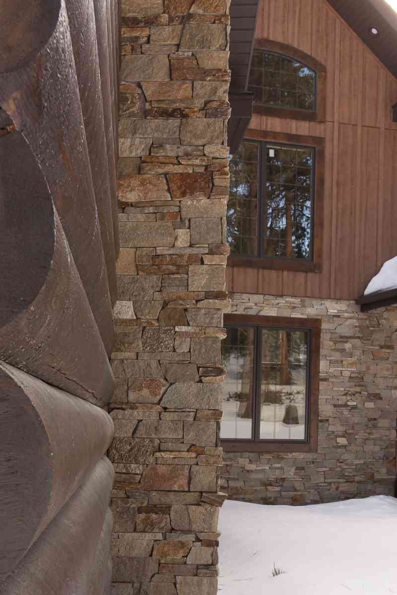 A close-up of the log and stone exterior pieces.