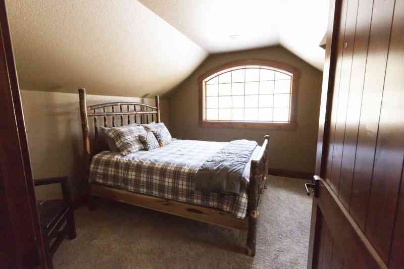 The upstairs guest room and its cozy window.