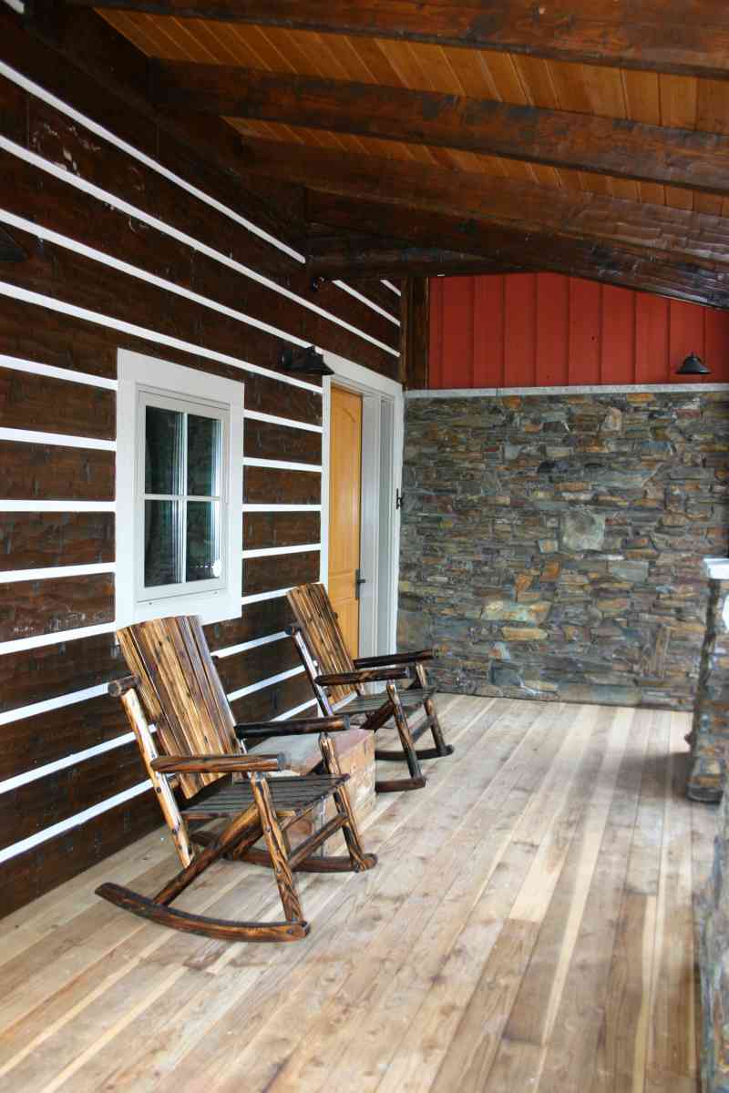 The cozy back porch complete with rustic rocking chairs!