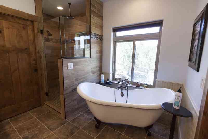 The master bath spa complete with an old fashion claw foot tub.