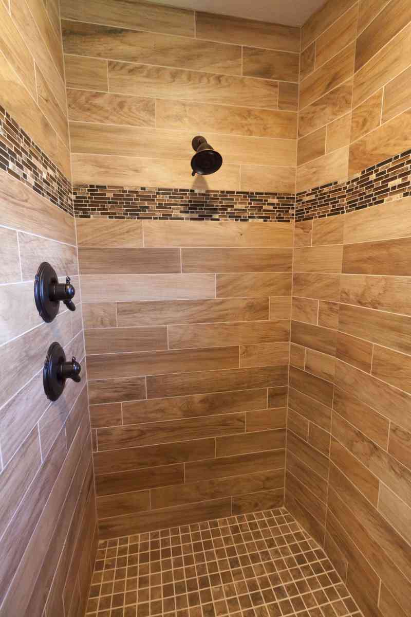 The beautiful, wood-like tile in the master walk-in shower.
