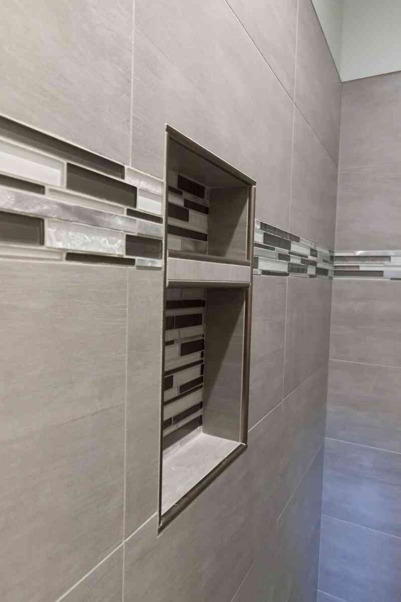 Conveniently placed, built-in shelving for the master shower.