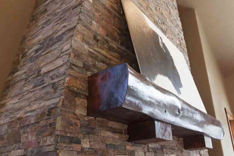 This mantle was hand-crafted by the Timberline team and compliments the dry-stacked stonework so well!