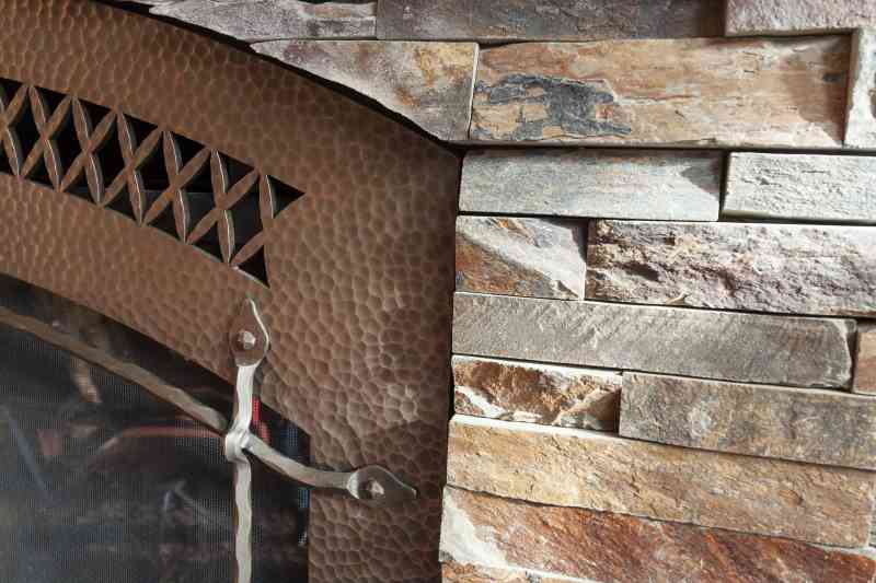 The stone and metal chosen for this fireplace were meant to be together!