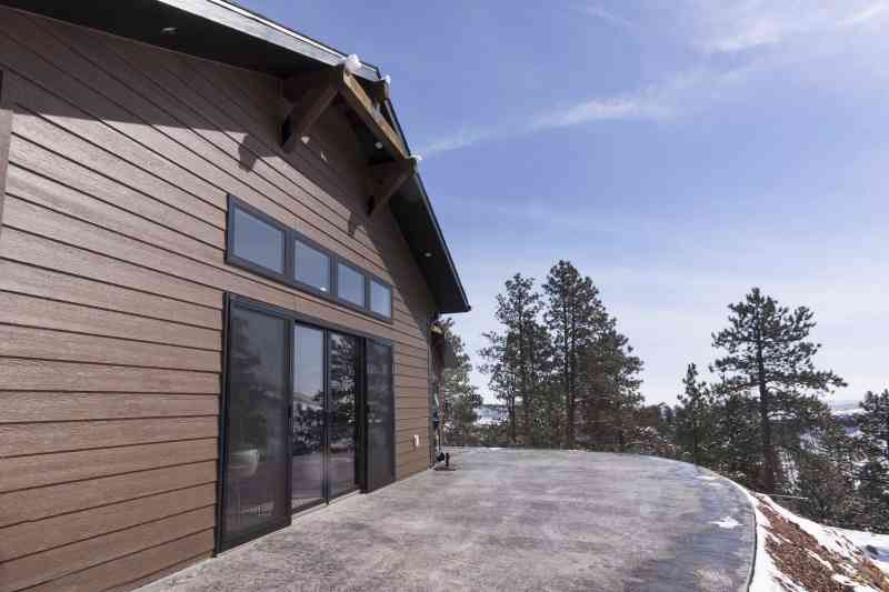 The back of this residence is set on the edge of a deep canyon with the stamped concrete deck coming right to the edge! 
