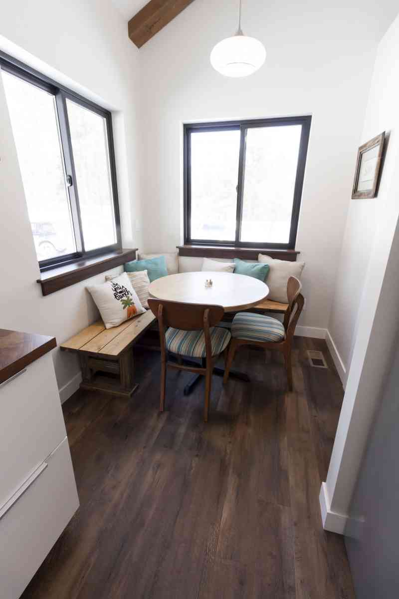 A custom-built breakfast nook next to the walk-in pantry.